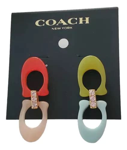 aretes coach originales precio